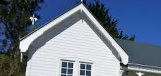 picture of a decorative bargeboard on the gable of the house