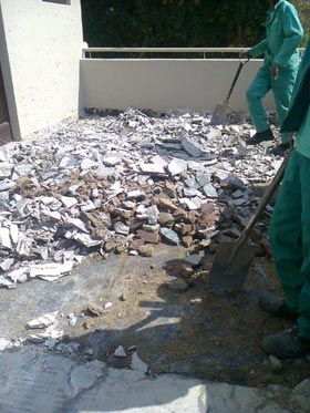 photo of a building roof being repaired